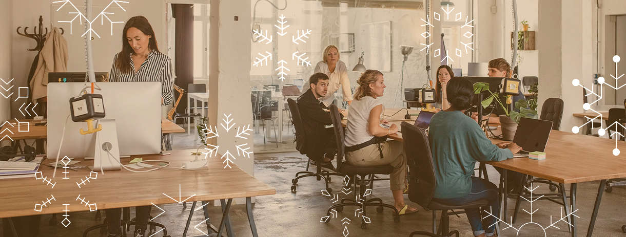 B.One Community Christmas/December Header Image - People working & exchanging together in a Coworking Space